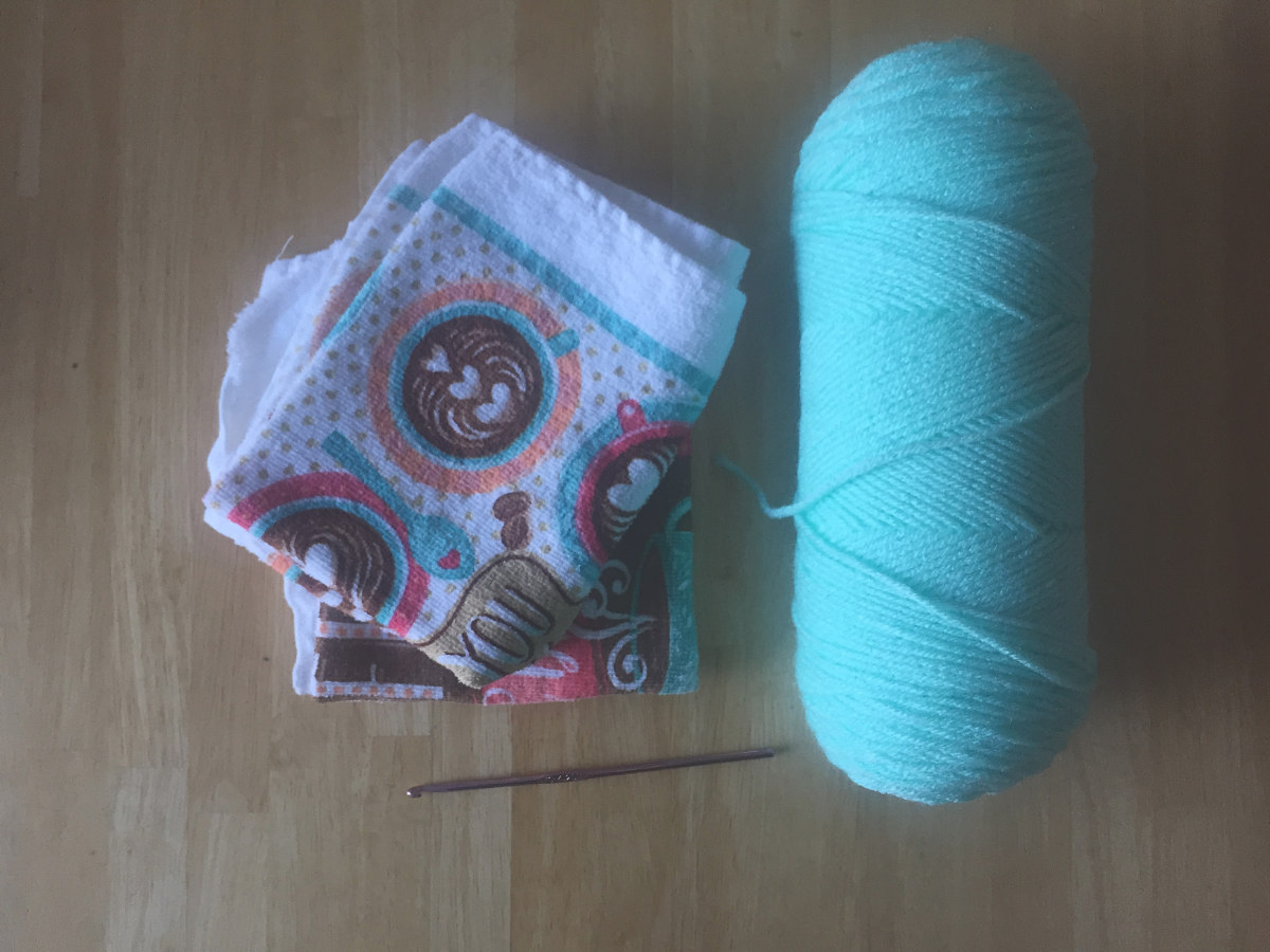 yarn, tea towels, and a crochet hook